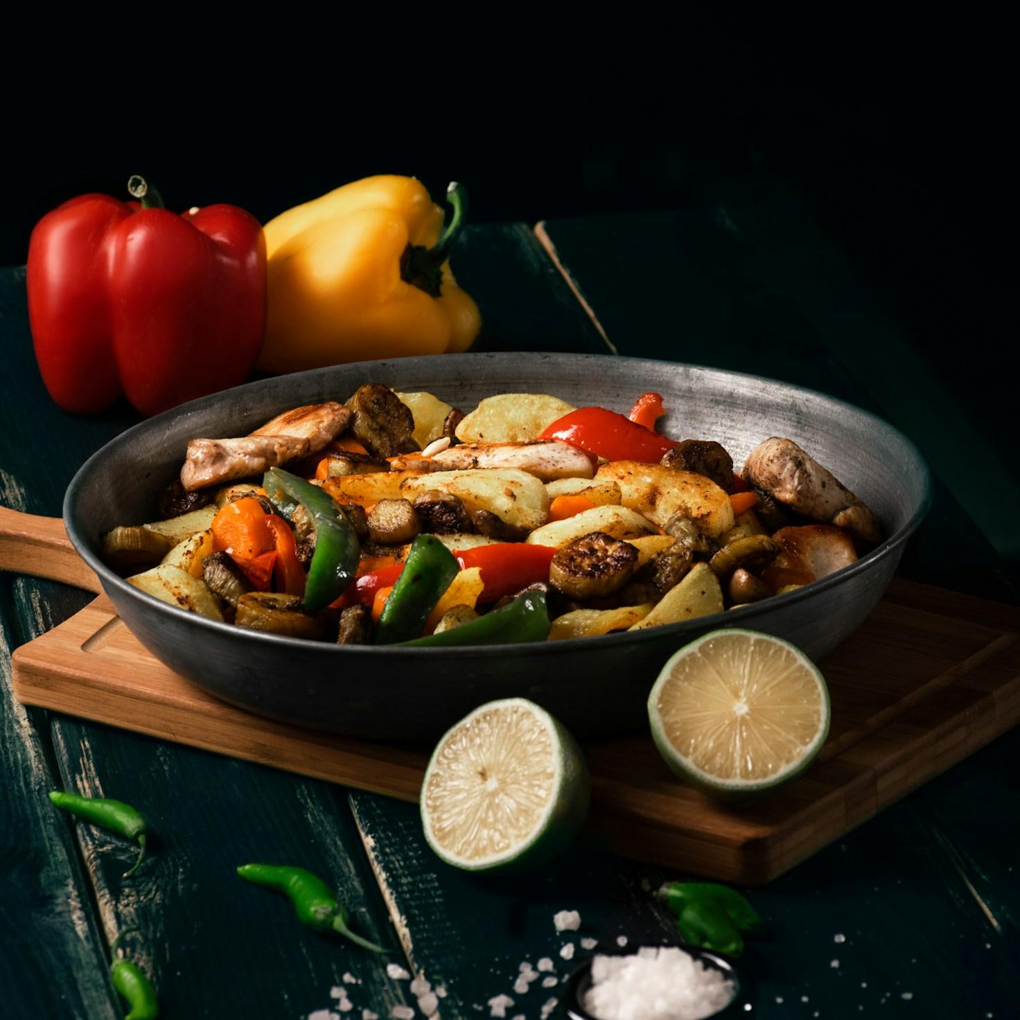 Community members collaborating in a modern kitchen space, sharing recipes and cooking techniques